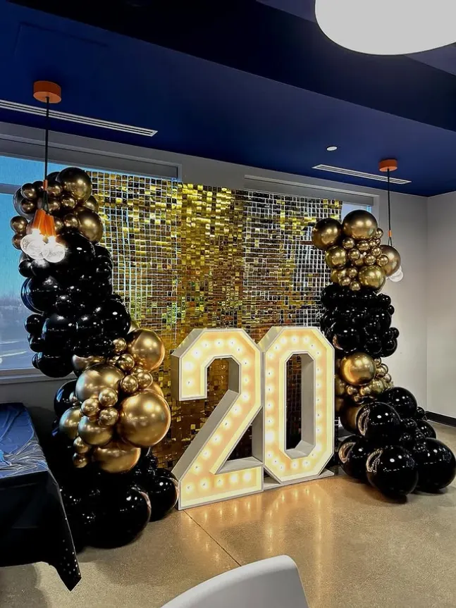 Corporate 20-year milestone marquee with balloon styling