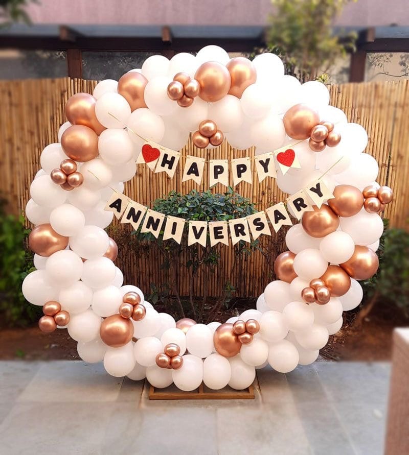 Elegant Rose Gold Anniversary Setup balloon decoration setup in Delhi NCR